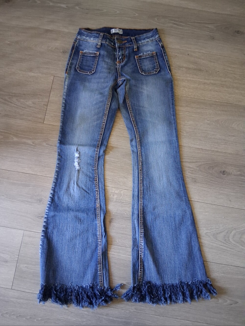 Soundgirl Medium Wash Distressed Flare Jeans With Fringe Hems